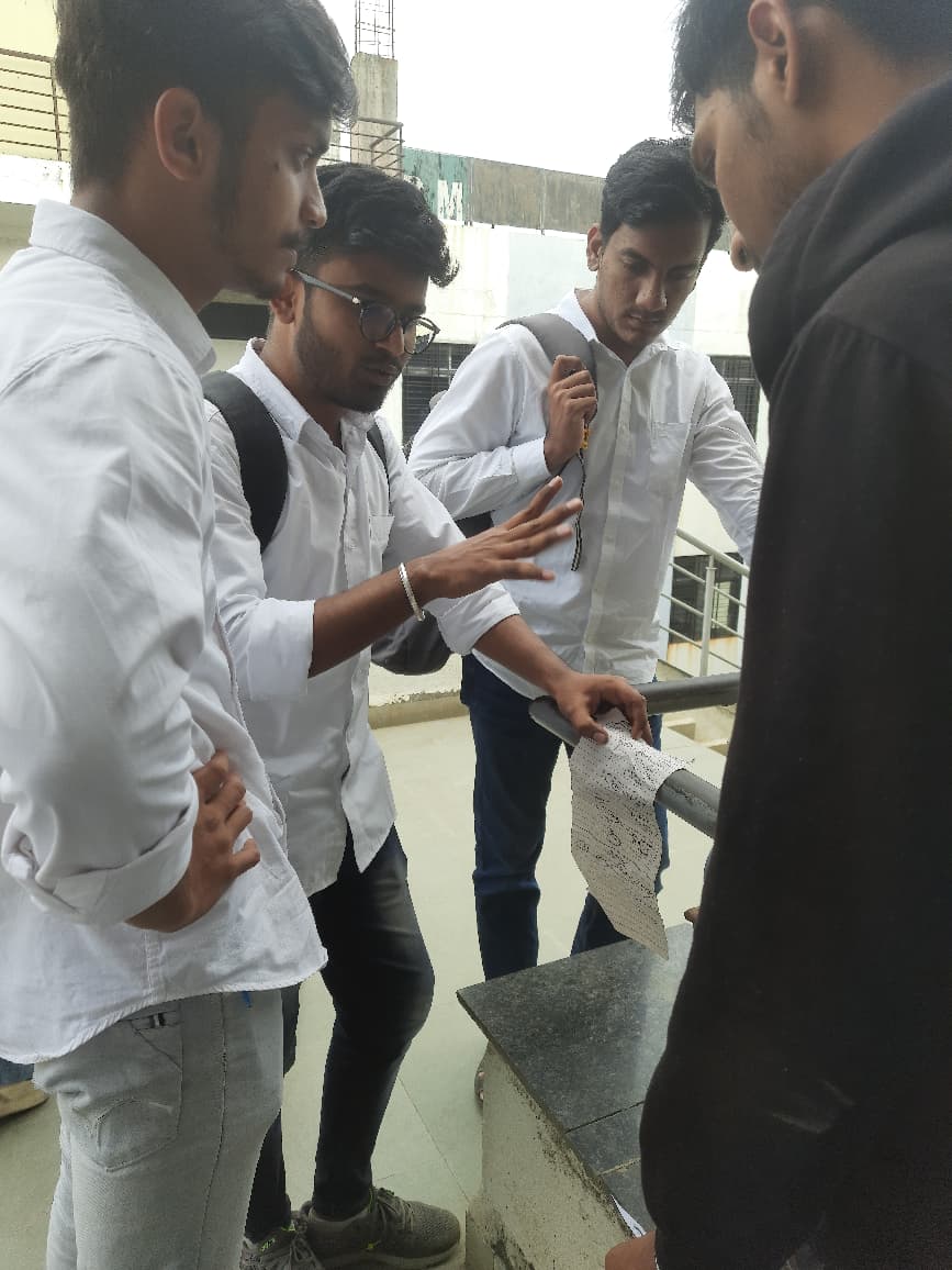 Team working together with laptops during the hackathon